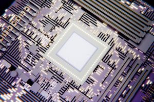 A glowing square microchip on a futuristic circuit board.